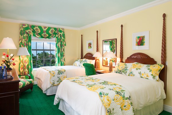 An abundantly floral guest room. Photo courtesy of Colony Hotel