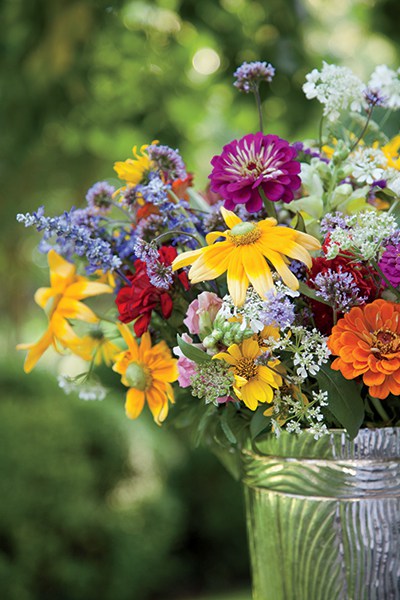 A casual arrangement that looks freshly gathered from both field and garden includes zinnias, snapdragons, coneflowers, coreopsis, wild statice, Minoan lace, and salvia