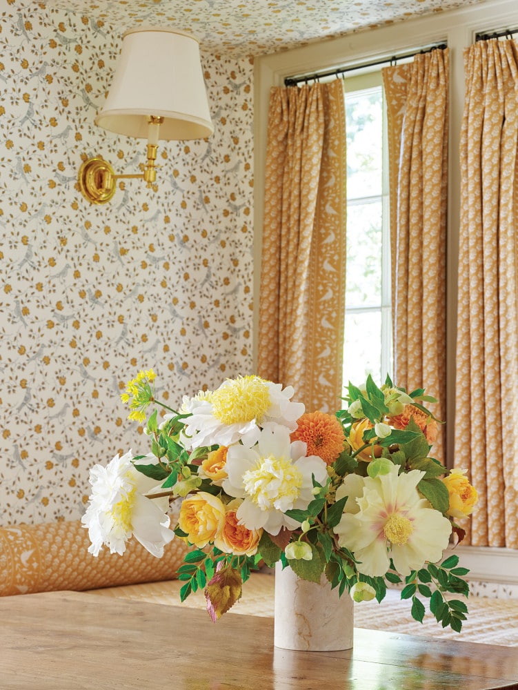 yellow flower arrangement by Bows & Arrows; interiors by Cathy Kincaid
