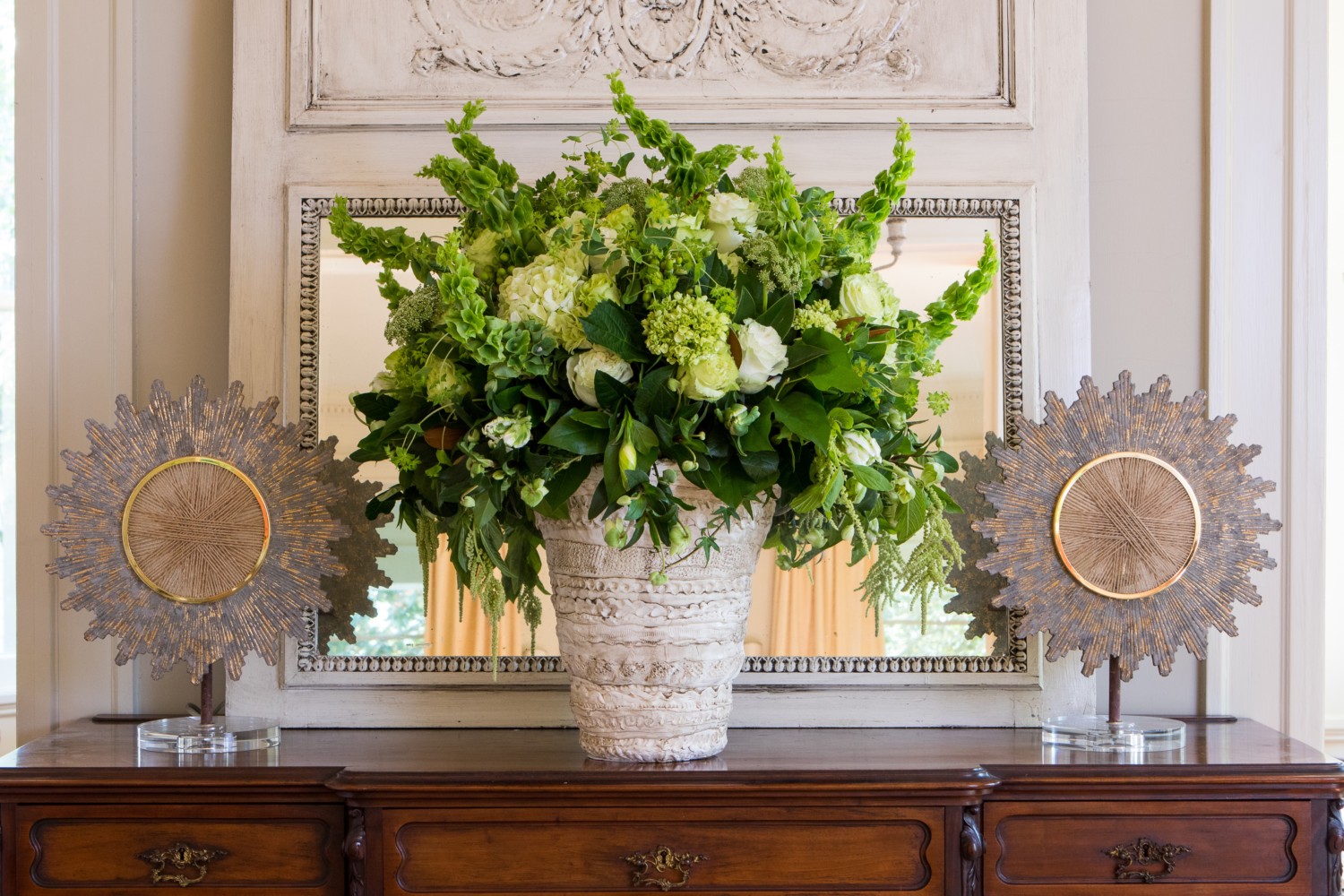 New Orleans floral designer Margaret Ludwig of Giverny Design creates a monochromatic green arrangement in the French style.