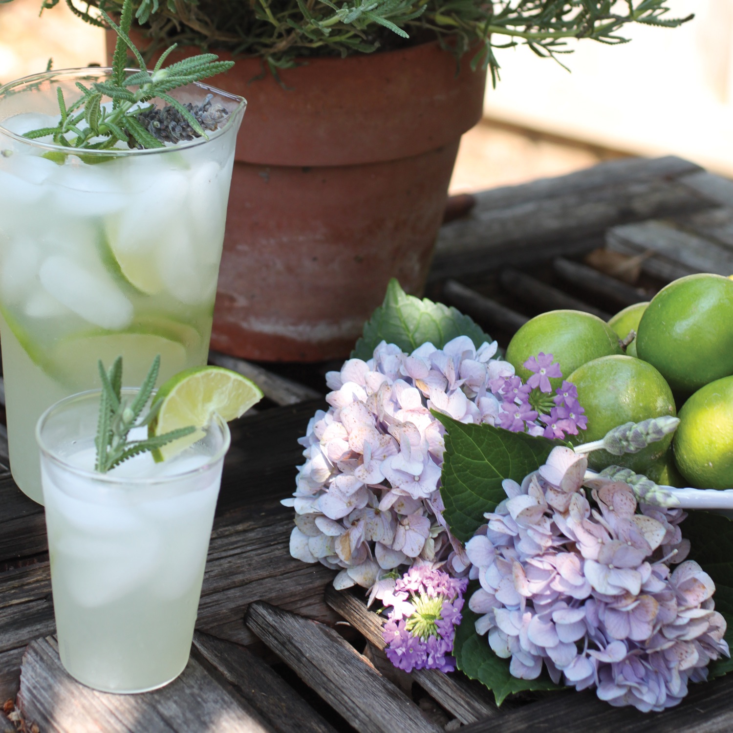 james farmer limeade with rosemary garnish, fresh-cut hydrangea and crepe myrtile blossoms, summer drinks