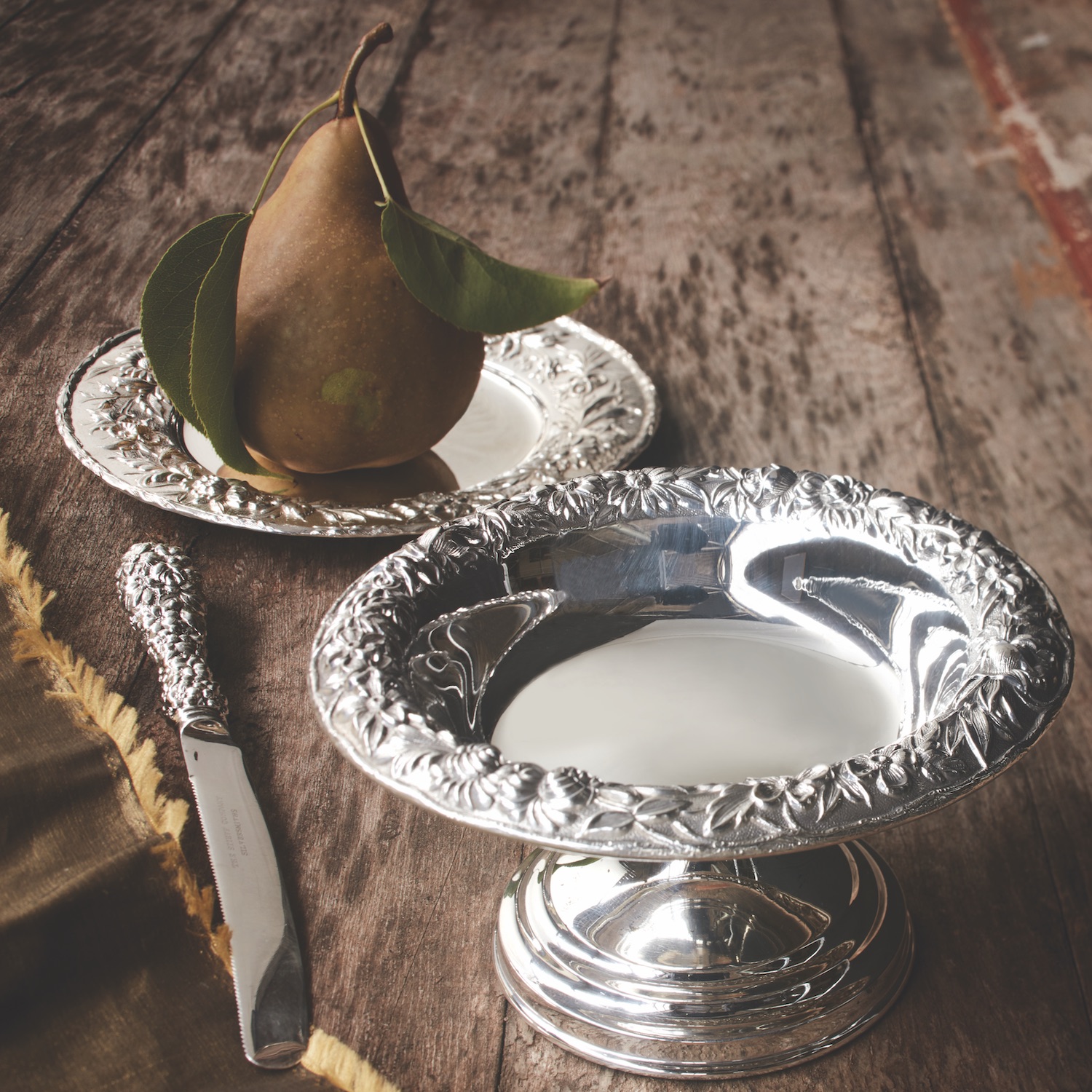 Repoussé silver compote and bread and butter plate (with pear)