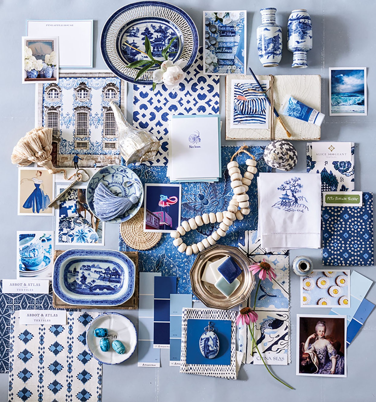 A collage of blue-and-white, including china pieces, wallpaper, paint swatches, textile swatches, jewelry, llnens, and inspration photos