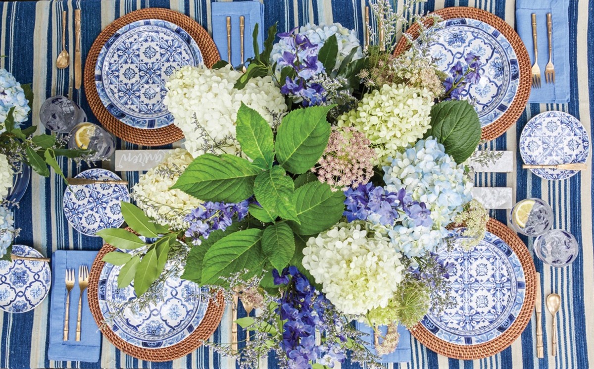Hydrangea flowers arranged on a blue and white table