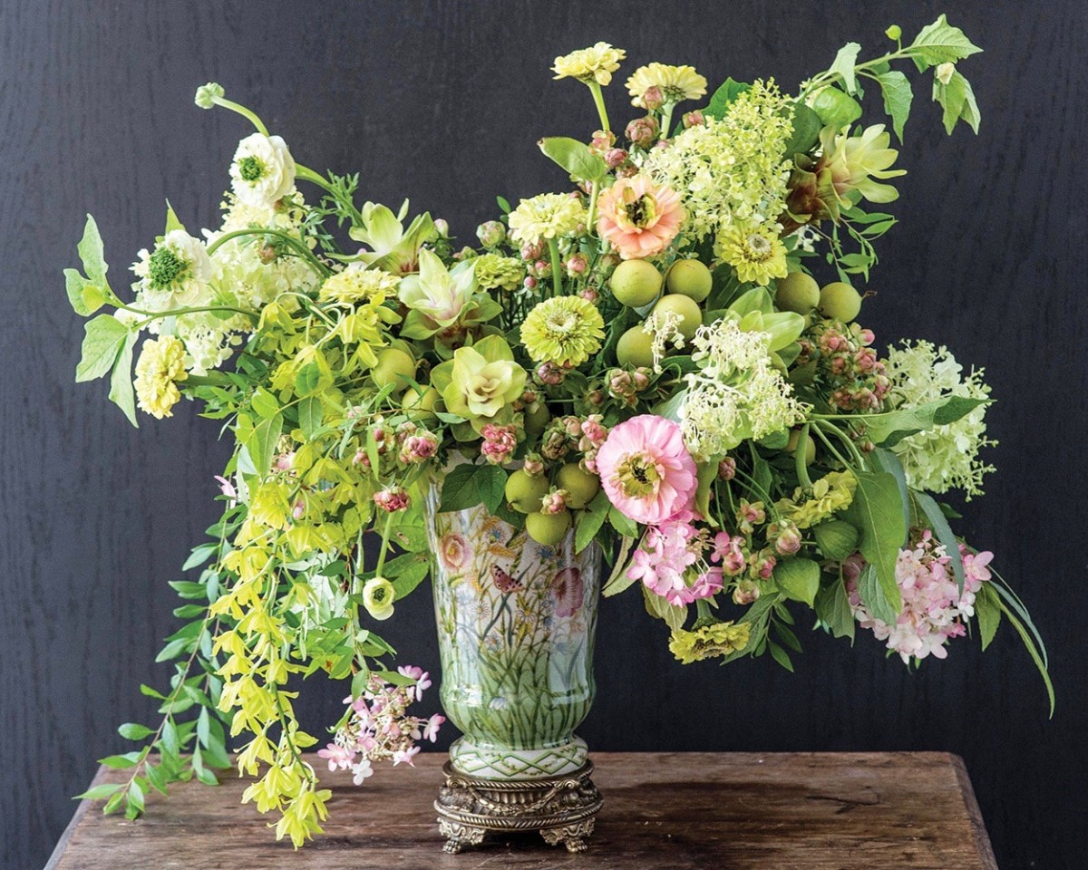 Lush Floral Arrangement featuring a lime color scheme touches of blush pink