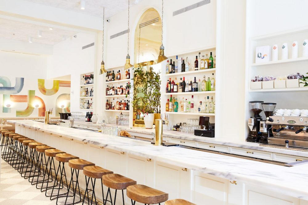 long marble bar inside Il Florista, a new restaurant in New York City