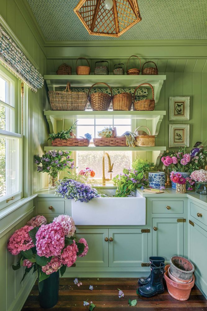 Flower room at Grey Gardens filled with pots and buckets of flowers