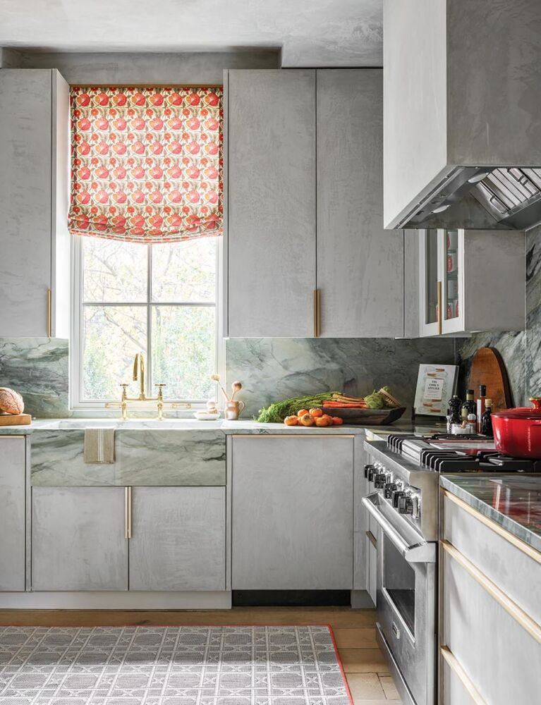 Catering kitchen with a gray plaster pastellone finish from Domingue that covers the Kingdom Woodworks cabinetry, ceiling, walls, and hood. Room designed by Melanie Millner.