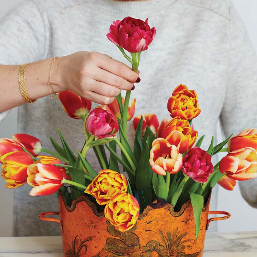 Step 4: Mimi Brown adds cerise parrot tulip to her arrangement last