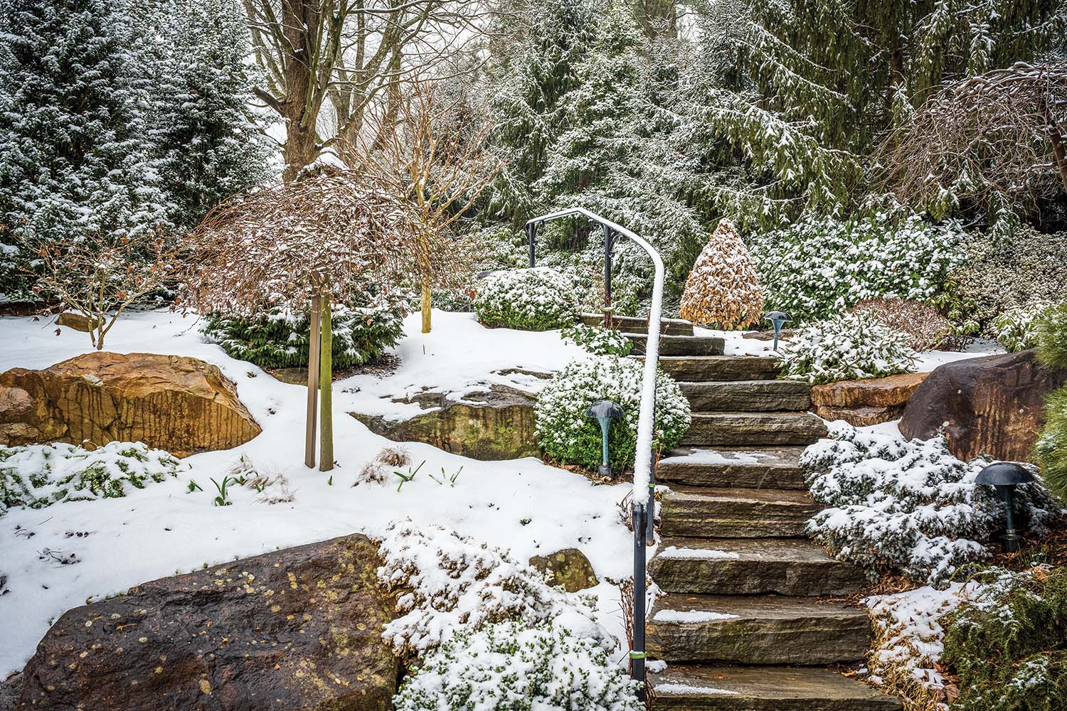 Stone stairs dusted with snow.