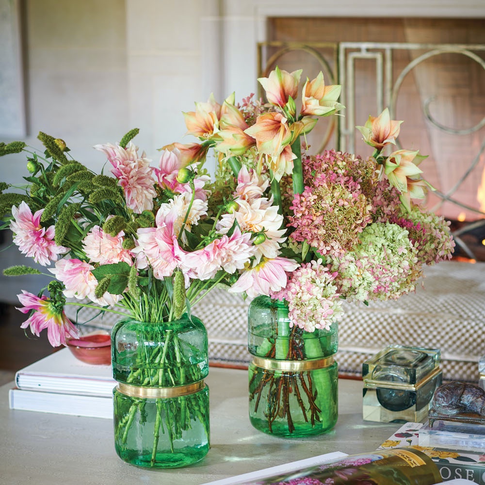 clear green vases with Dutch amaryllis, pink dahlias, and hydrangeas