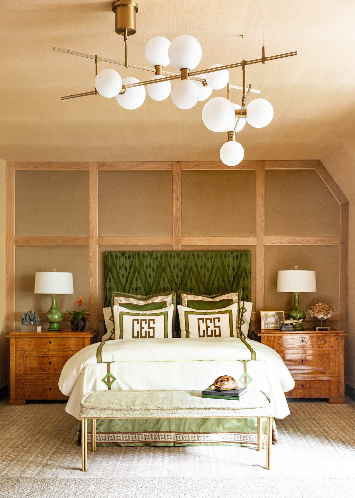 Fort Worth designer Trish Sheats creates balance and drama in a guest room with ceramic bedside table lamps and a bold contemporary sputnik-like ceiling light fixture.