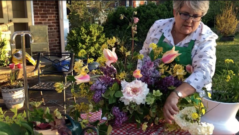 Jeanette Cadwallender of Garden Club of Virginia arranges spring flowers cut from her Fredericksburg garden