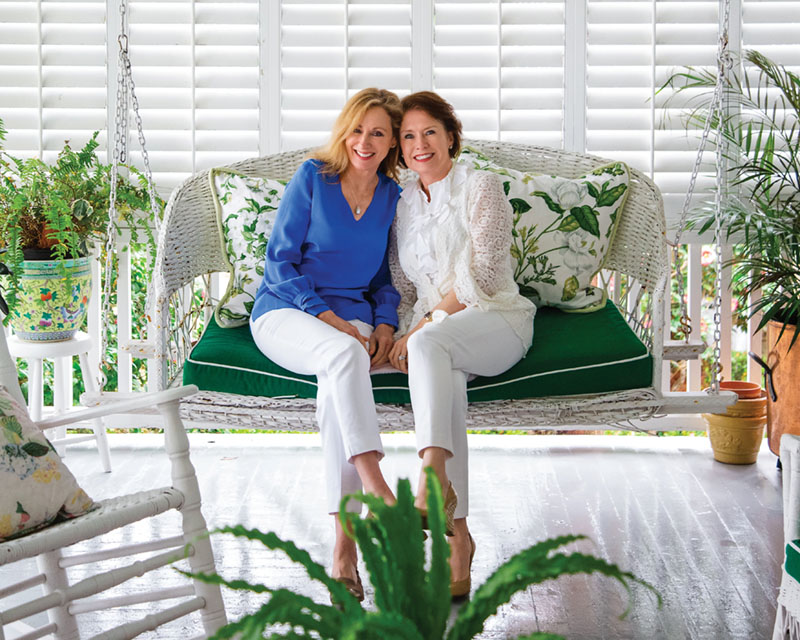 portrait of the founders of the skincare line Sapelo sitting together on a porch swing