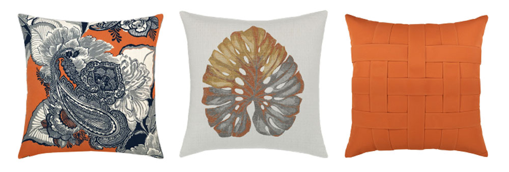 pillow designs include orange background with a white and navy floral paisley design; a metallic gold, silver, and copper leaf on a white background, and a basketweave pillow in bright orange