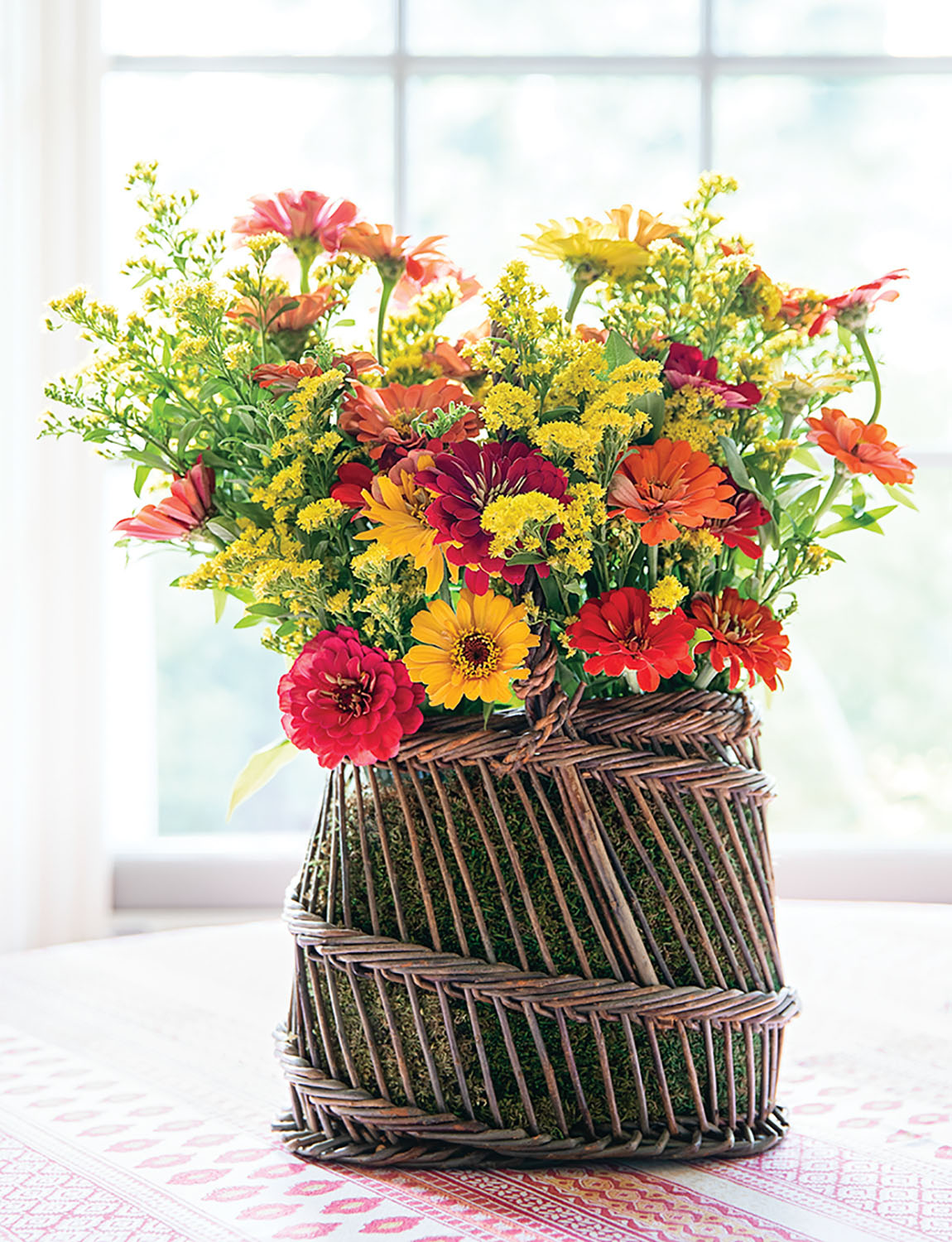 A colorful arrangement in a basket, from the pages of CHARLOTTE MOSS FLOWERS