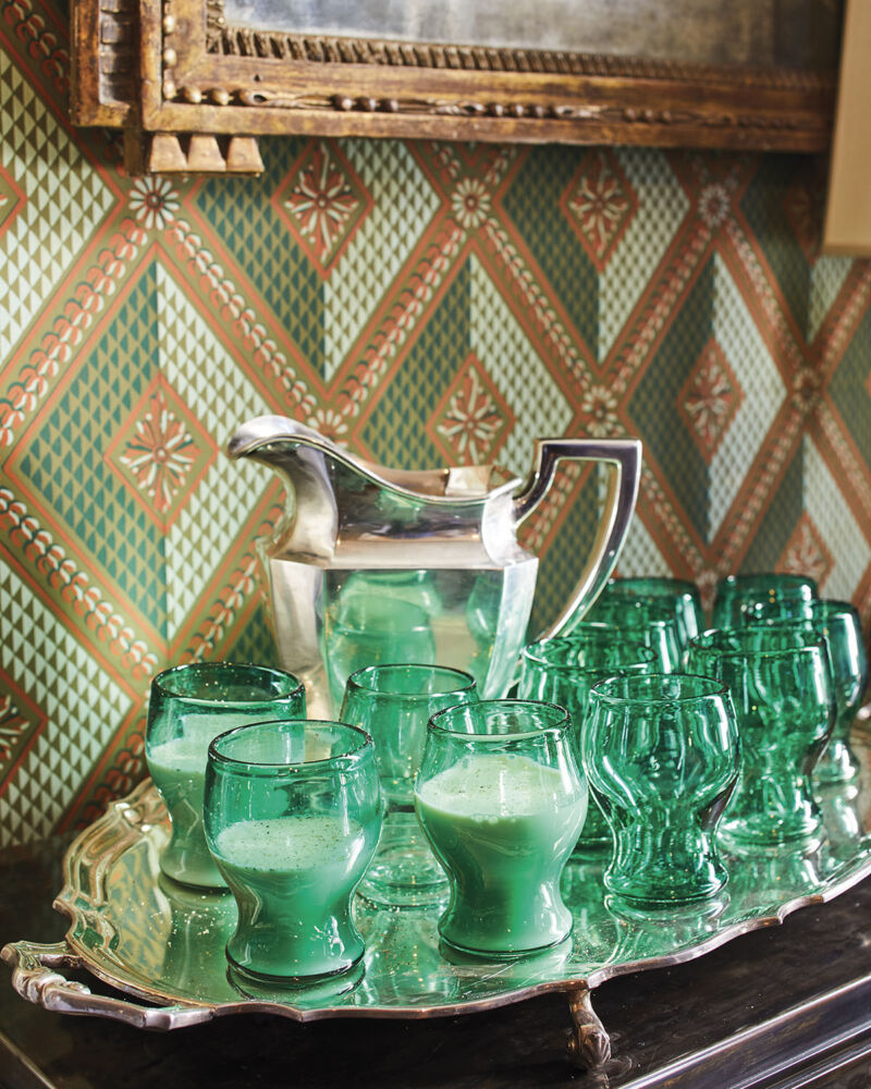 Julia Reed's Milk Punch served from a silver pitcher on a silver tray filled with green goblets