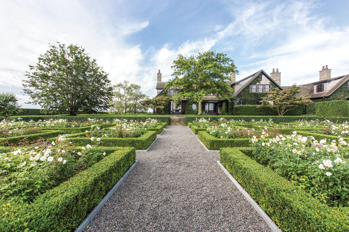 hedged garden parterres filled with roses