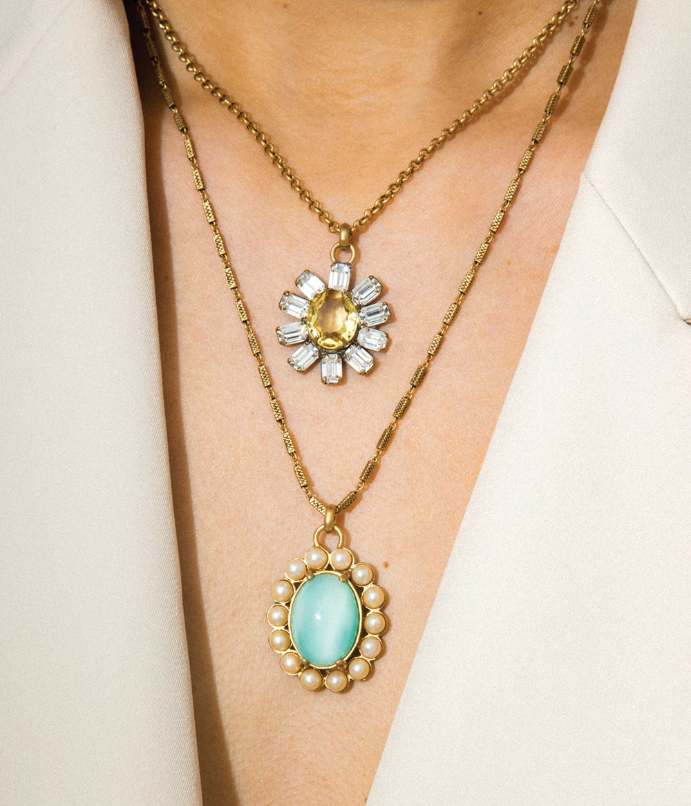 a pair of short and long pendant necklaces worn by a model, by Lauren Hope