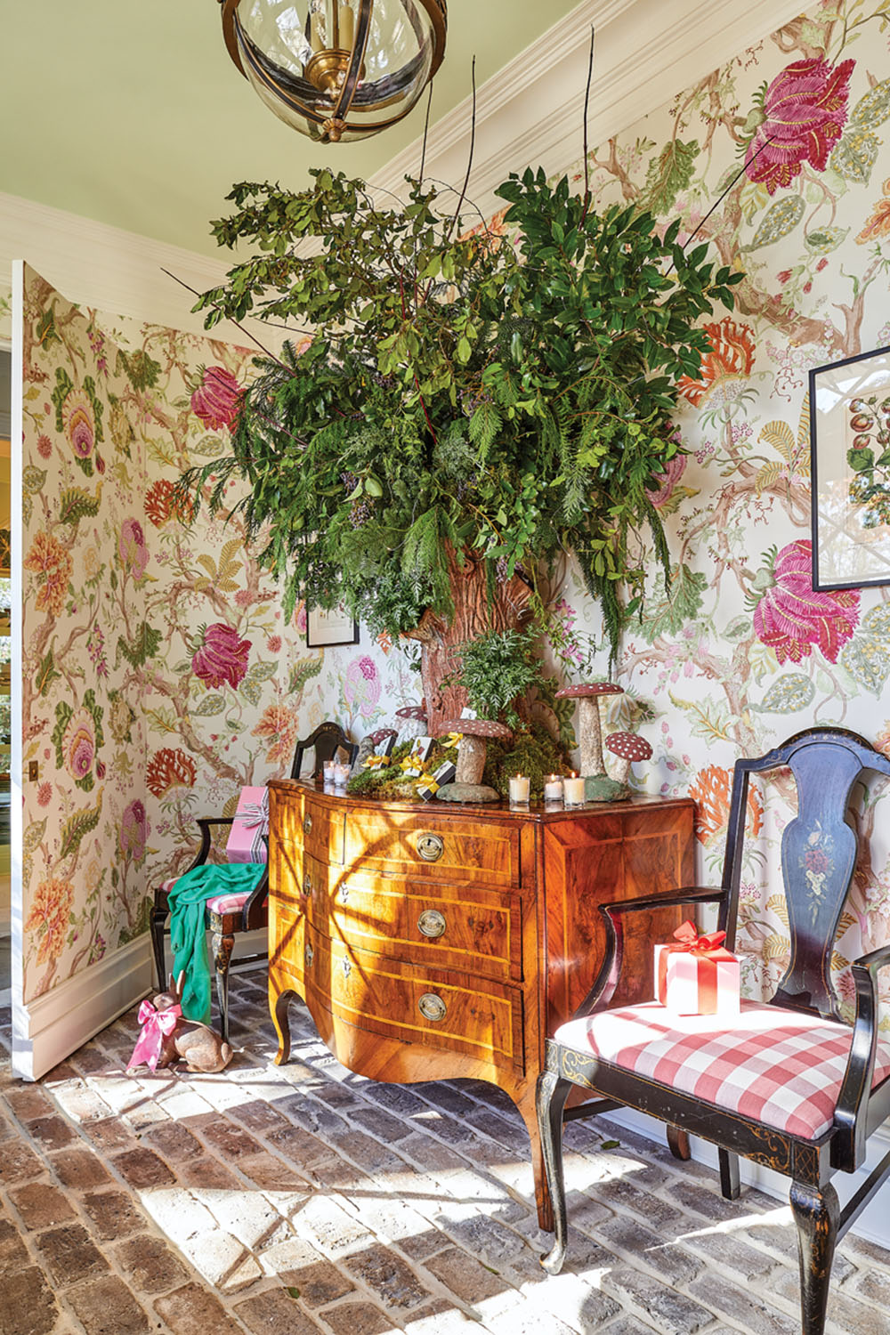 foyer decor, floral wallpaper, greenery arrangement, brick floor