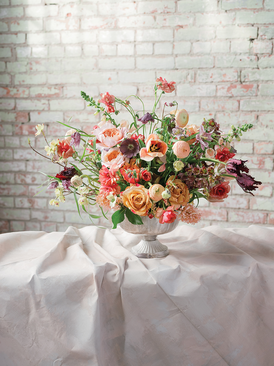 peach, gold, and red flower centerpiece at floral workshop