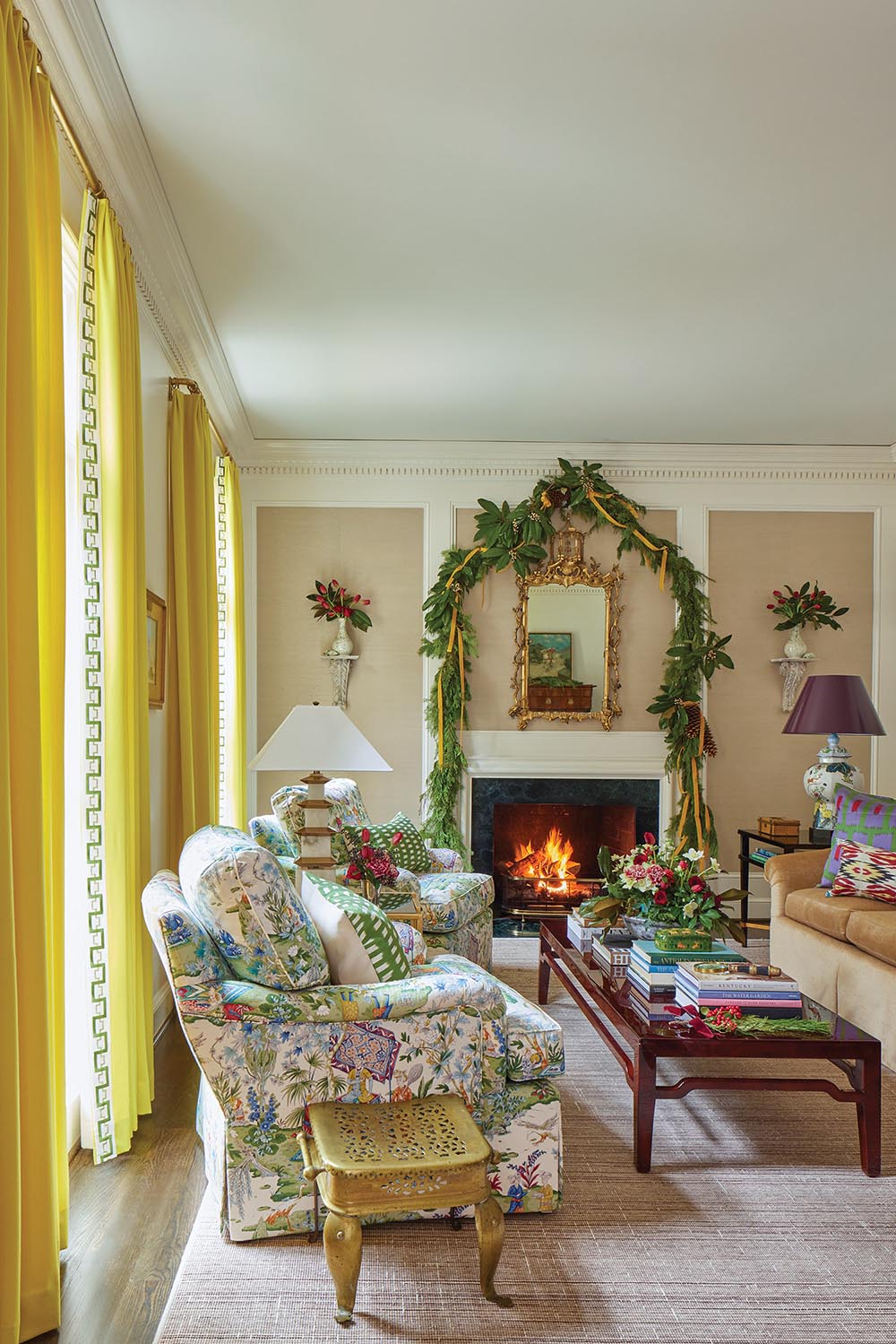 living room decorated with garland, magnolia and other flowers