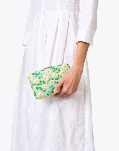 Green clutch with cream flowers from Halsbrook.