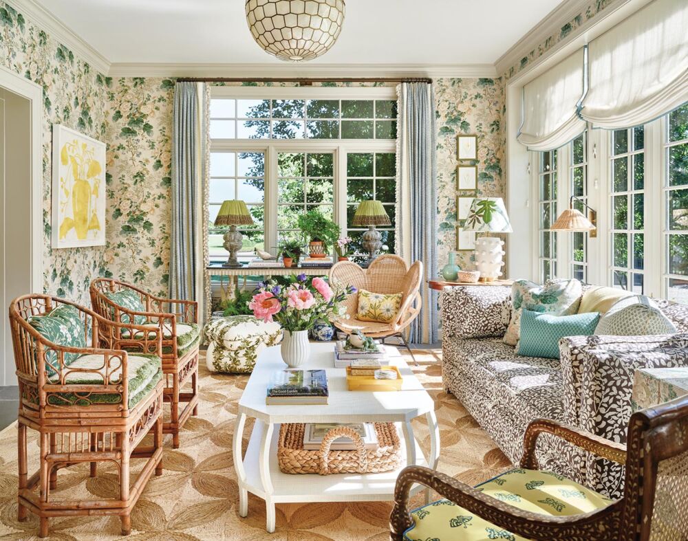 Sunroom with Lee Jofa's iconic Hollyhock fabric covering the walls.