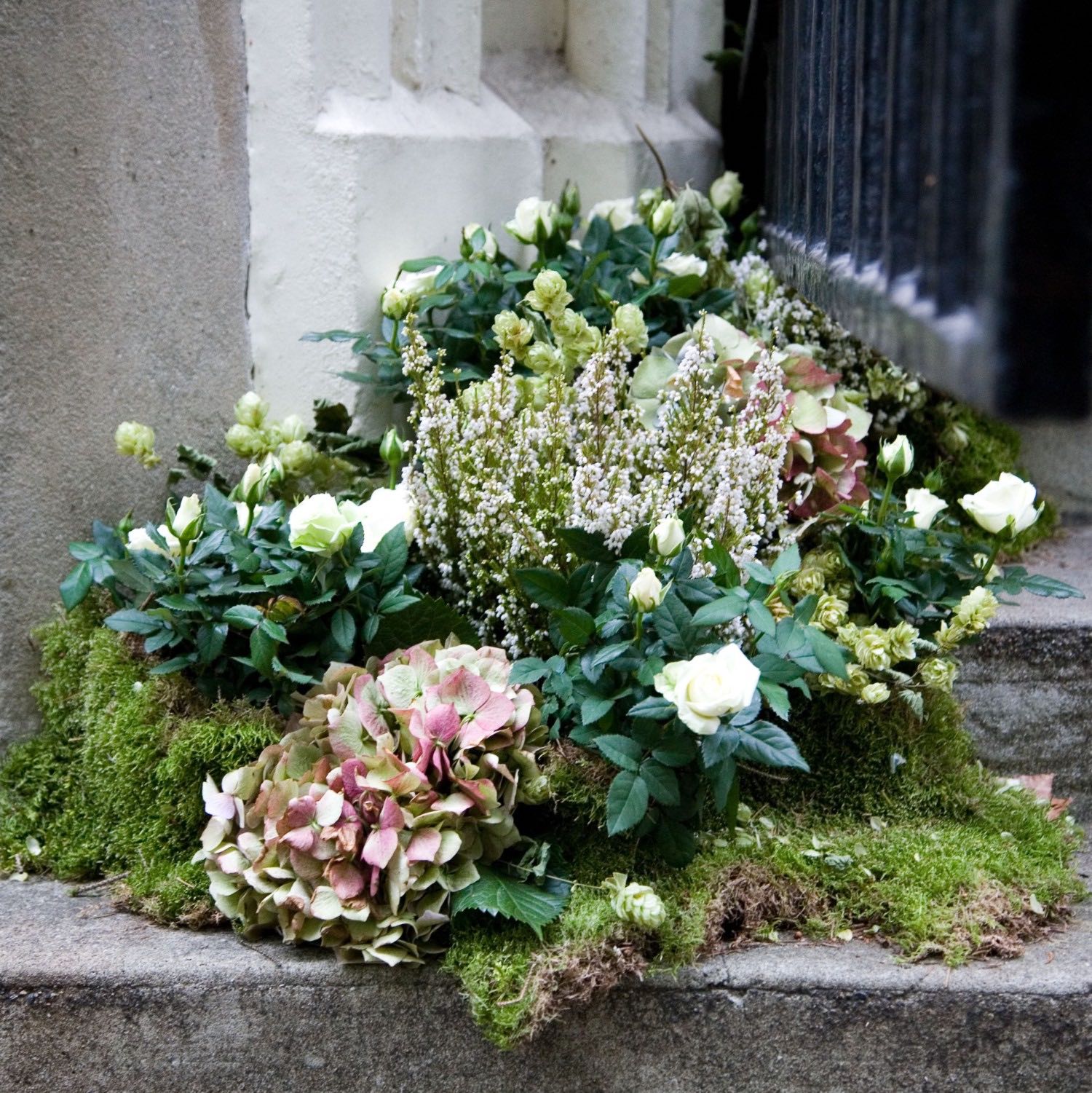 For a storybook London wedding, heather, moss, and hydrangeas were nestled upon the stone church steps.