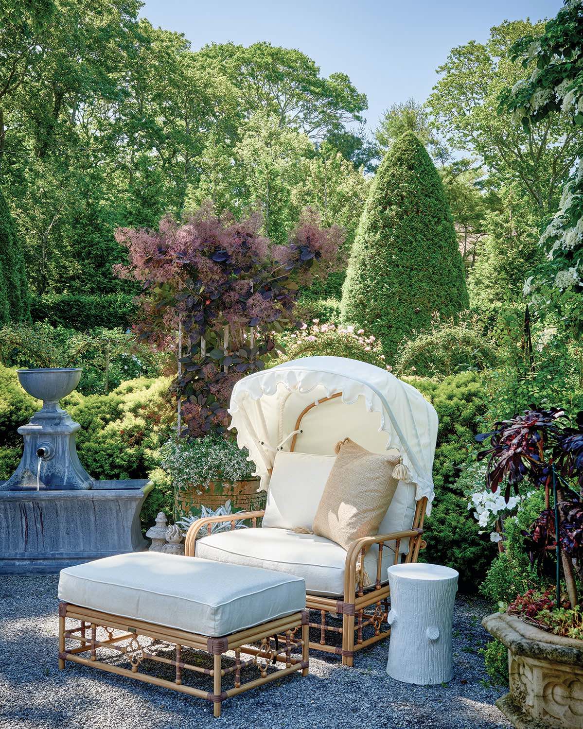 A canopied chair from Lane Venture, one of a pair, provides respite from the sun. “They’re a great place to have coffee in the morning, and they’re wide enough to get a dog or two by my side, a very important feature,” says Moss.