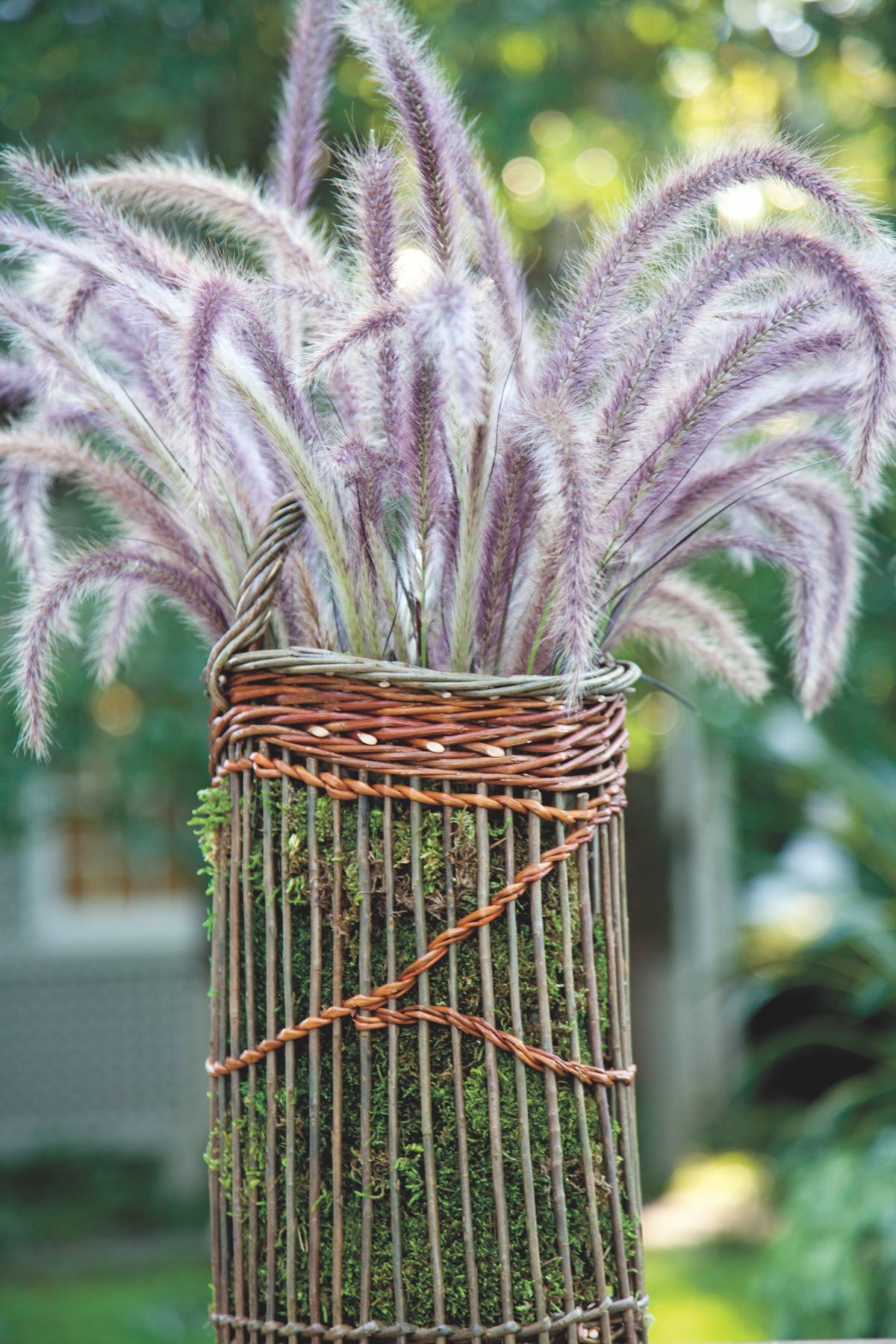 A simple gathering of fountain grass spilling from a basket