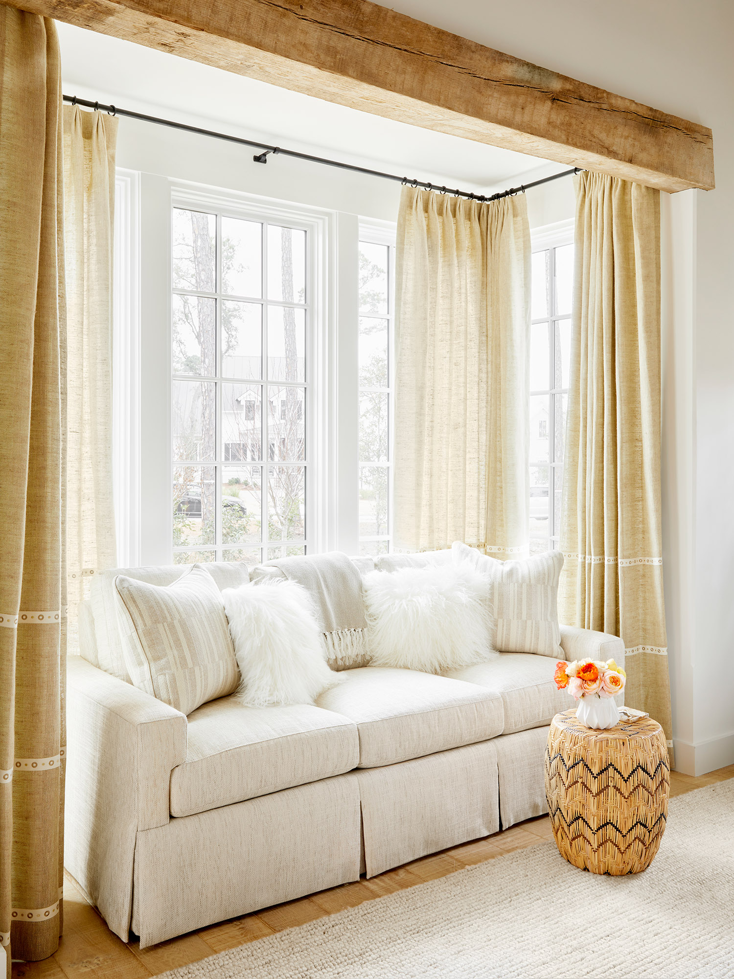 Antique timber framed bay window with white sofa, Phoebe Howard's Snug sofa from Sherrill Furniture
