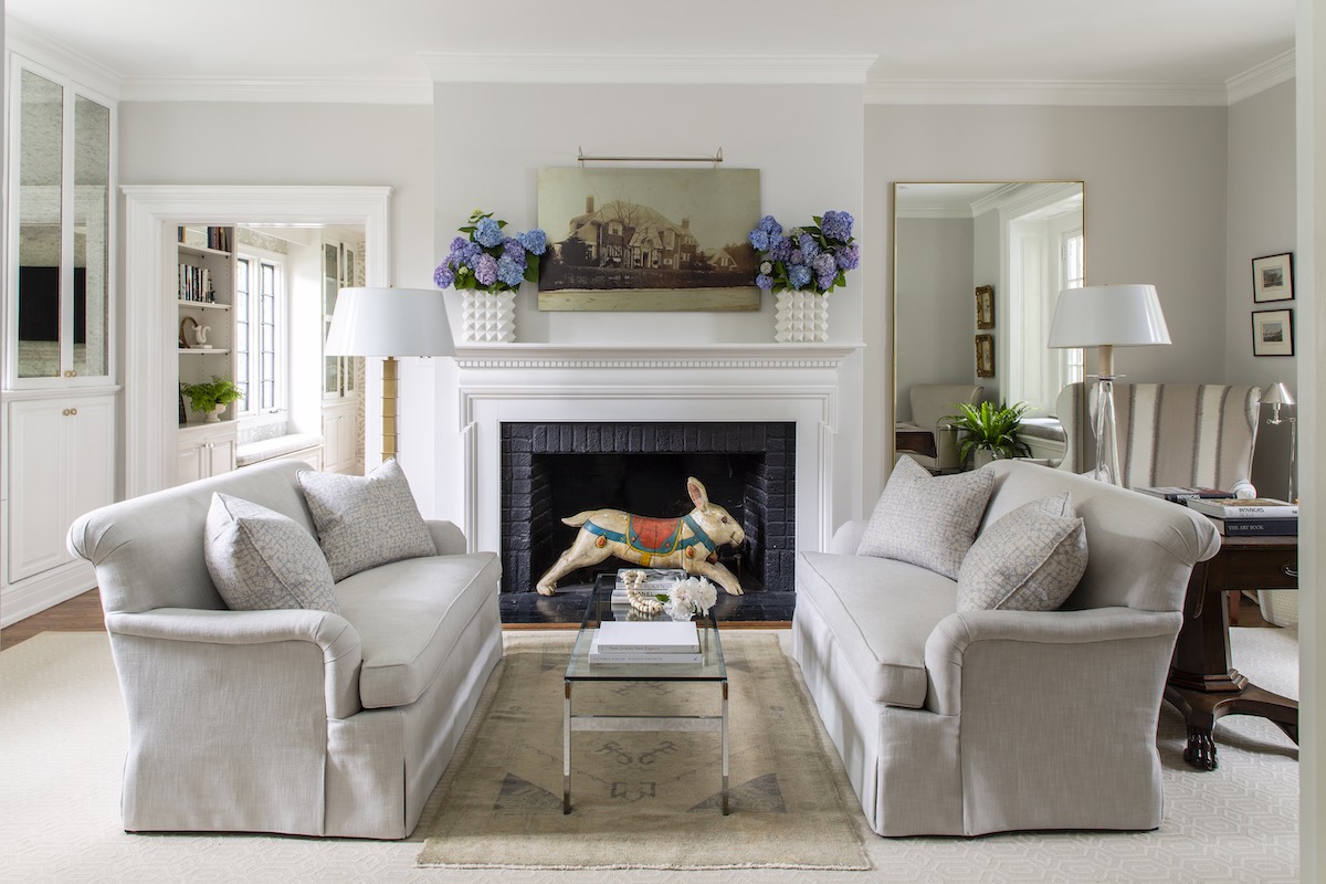 Tollett prefers two matching sofas instead of a sectional if the room allows it. Here she include rolled arm styles with bench cushions in a neutral fabric for a calming look.