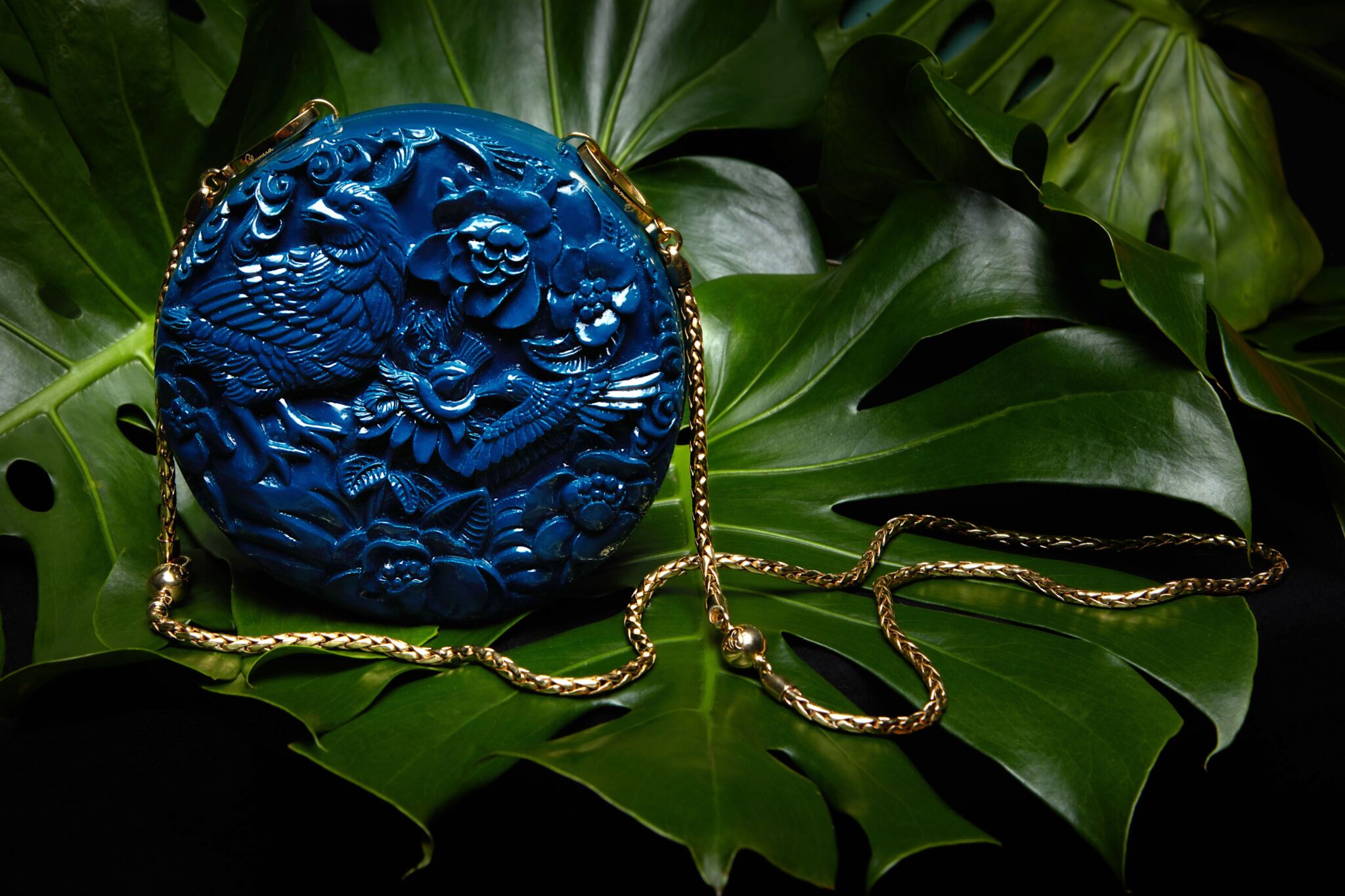 Conference of the Birds Large Ushape and Rose and the Nightingale Clutch hand-carved and hand-painted in lacquered blue.